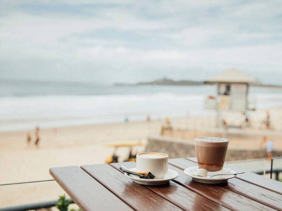 mooloolaba-surf-club-coffee-on-deck-with-view-of-beach