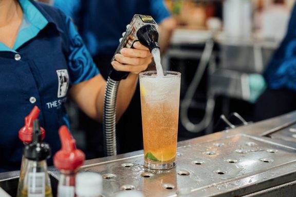 mooloolaba-surf-club-filling-glass-with-soft-drink